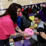 Lemoore Booster Club President Vicki McCarthy accepts donations at Tuesday's basketball game. Boosters raised over $1,000.
